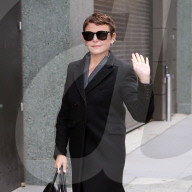 Ginnifer Goodwin is spotted in a gray pinstripe pant suit, black wool overcoat and Mulberry Bayswater handbag at The View in New York City