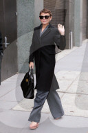 Ginnifer Goodwin is spotted in a gray pinstripe pant suit, black wool overcoat and Mulberry Bayswater handbag at The View in New York City