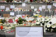 Flowers And Candles To Honor Victims Of 2015 Terrorist Attacks In Paris