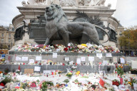 Flowers And Candles To Honor Victims Of 2015 Terrorist Attacks In Paris