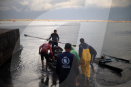 alestinian Fishermen Row Their Boats In Gaza City Port