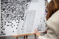 Flowers And Candles To Honor Victims Of 2015 Terrorist Attacks In Paris