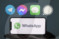 WhatsApp Logo Displayed On A Smartphone With Other Messaging App Icons In The Background
