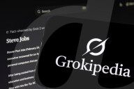 Grokipedia Logo Displayed On Smartphone Over Computer Keyboard