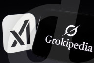 Grokipedia Logo Displayed On Smartphone Over Computer Keyboard