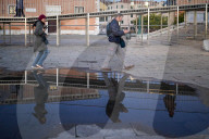 People Walking While Using Smartphones In Venice