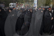 Veiled Iranian Women Participate In A Funeral For Unknown Martyrs
