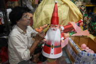 Ethnic Chinese Indian Artist Chang Making Santa Claus Dolls Ahead Of Christmas In Kolkata