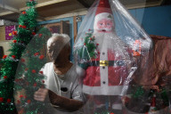 Ethnic Chinese Indian Artist Chang Making Santa Claus Dolls Ahead Of Christmas In Kolkata