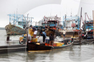 Despite Extreme Weather, Fishermen Still Catch Fish In Indonesia