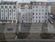Snow Rain Falling On Wet Traffic Intersection In Munich