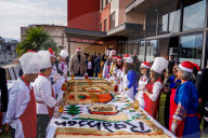 People Are Participating In A Christmas Cake-mixing Ceremony In Kathmandu, Nepal