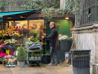 Florist Tends To Flower Display At Venice Shop