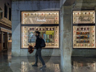 Illuminated Venchi Storefront Displays Chocolate And Gelato In Venice At Night