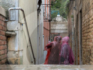 Two People In Rain Ponchos Near Peggy Guggenheim Collection