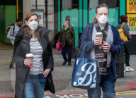 Travellers wear masks at London Victoria Station. 