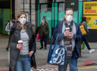 Travellers wear masks at London Victoria Station. 