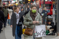 Travellers wear masks at London Victoria Station. 