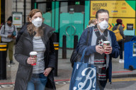 Travellers wear masks at London Victoria Station. 