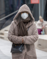 members of the public wear masks at London Bridge.