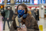 Travellers wear masks at London Victoria Station. 
