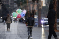Child Selling Light-Up Balloons in Beirut