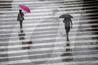 Pedestrians Face Rain In Downtown Sao Paulo