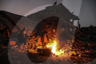 Gazans in tents resort to rubble fires for warmth