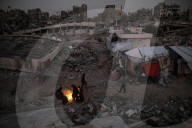 Gazans in tents resort to rubble fires for warmth