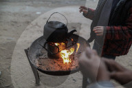 Gazans in tents resort to rubble fires for warmth
