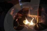 Gazans in tents resort to rubble fires for warmth