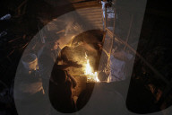 Gazans in tents resort to rubble fires for warmth